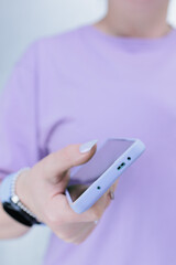 Woman's hands holding a large smartphone