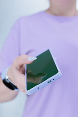Woman's hands holding a large smartphone