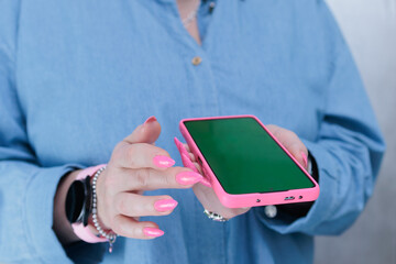 Woman's hands holding a large smartphone