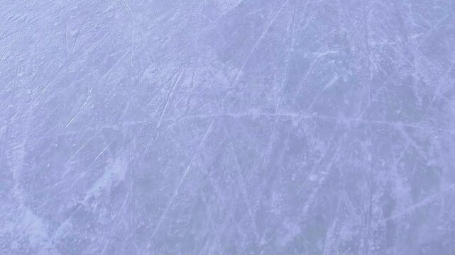 Close-up video shooting the rugged ice surface of the stadium after skating.