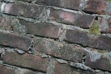 Abandoned mossy brick layered wall background, Grungy brick wall texture background, Weathered rusty brick backdrop