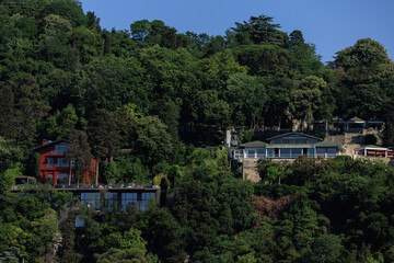 Southern cityscape, view of buildings and houses with green plants in public places in Turkey, sunny summer day in the city of Istanbul