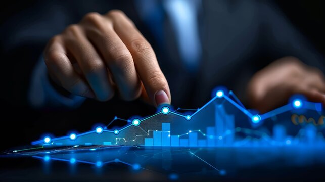 Businessman analyzing digital data on a futuristic interface with a glowing graph. Concept of modern finance and data analysis.
