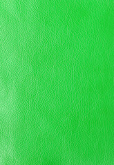 Texture of genuine leather, artificial leatherette green background