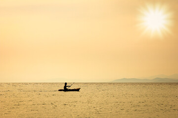 A beautiful yacht sailing in the sea silhouette background