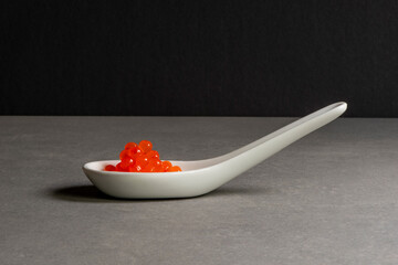 Red caviar on spoon