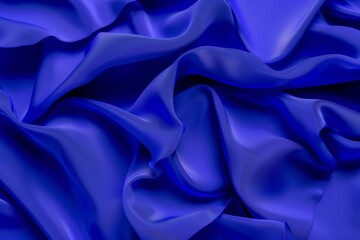 Obraz premium Smooth, shiny blue satin fabric is flowing in soft folds, creating an elegant and luxurious background for design or art projects