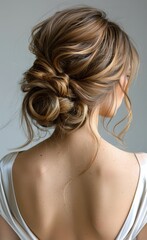 Woman With Blonde Hair in a Messy Bun Wearing a White Dress