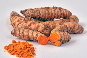 Tumeric root on white background