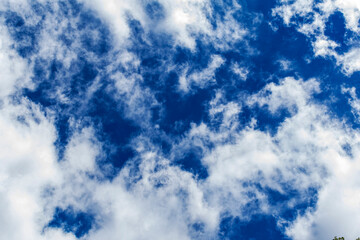 eautiful blue sky with many clouds. Space for advertising. Horizontal.