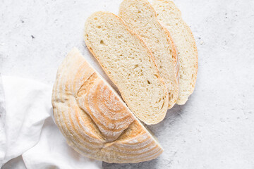 Overhead view of sliced homemade artisan bread, top view of baked sourdough artisan bread slices