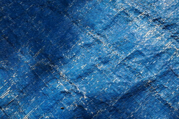 Blue grungy background with light shade, Rustic uneven material backdrop design, stripped particle weathered blue tent background