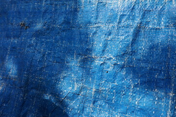 Blue grungy background with light shade, Rustic uneven material backdrop design, stripped particle...