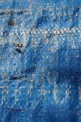 Blue grungy background with light shade, Rustic uneven material backdrop design, stripped particle weathered blue tent background