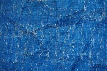 Blue grungy background with light shade, Rustic uneven material backdrop design, stripped particle weathered blue tent background