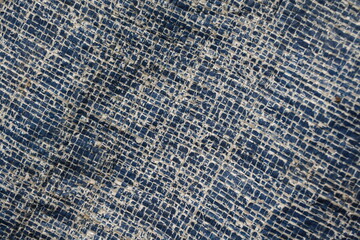 Weathered and damaged tent surface backdrop, grungy and rustic blue backdrop for presentation, cracked pattern texture background