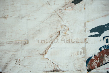 Torn and weathered street poster background, abstract paper collage backdrop