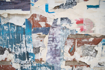 Fototapeta premium Torn and weathered street poster background, abstract paper collage backdrop
