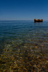 A group of tourists take a tour around the Agawa Rock Pictographs in in Lake Superior, Ontario.