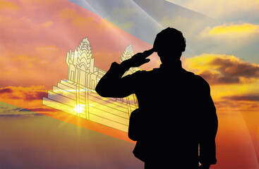 Silhouette of a soldier with a background of the Cambodia flag and a sunset or sunrise. Concept of national holidays. Commemoration Day.