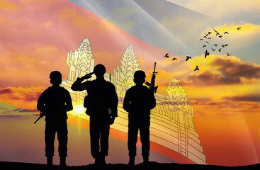 Silhouettes of soldiers with a background of the Cambodia flag and a sunset or sunrise. Concept of national holidays. Commemoration Day.