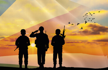 Silhouettes of soldiers with a background of the Seychelles flag and a sunset or sunrise. Concept of national holidays. Commemoration Day.