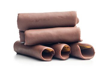Chocolate Covered Wafer Rolls Stacked On White Background