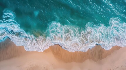 Fototapeta premium Beach and waves from top view. Turquoise water background from top view. Summer seascape from air. Top view. Travel concept and idea
