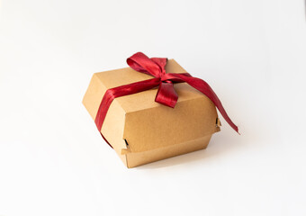 cardboard packaging, bento cake on white background, red bow