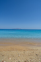 View of the amazing sandy and turquoise beach of Agia Theodoti in Ios Greece