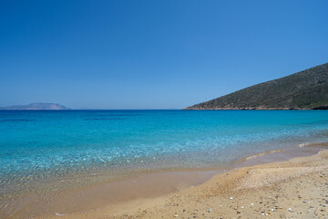 Fototapeta premium View of the amazing sandy and turquoise beach of Agia Theodoti in Ios Greece