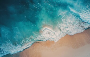 Aerial view of ocean waves hitting the beach