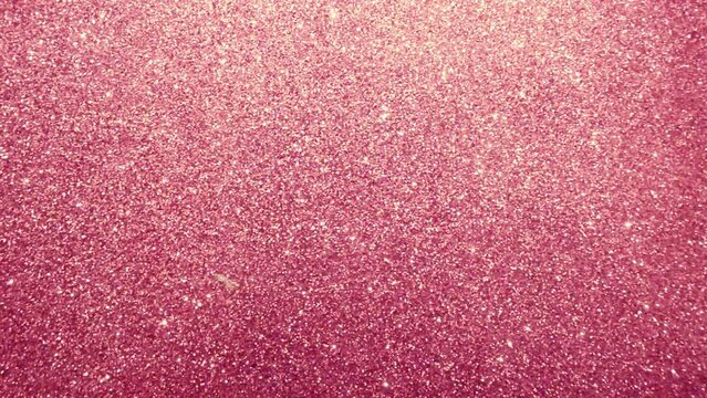 Pink glitter. Abstract blur pink glitter sparkle defocused bokeh light. Abstract background with shiny bokeh sparkles. Shiny glitter with light reflection