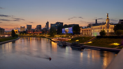 Obraz premium Vilnius night sunset panoramic cityscape with Neris river, church and skyscrapers of New Center. Lithuania, Baltic states.