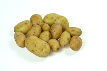 small field potatoes on white background