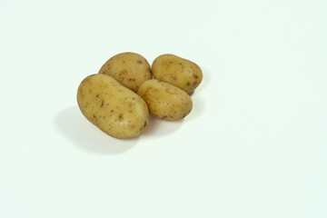 small field potatoes on white background