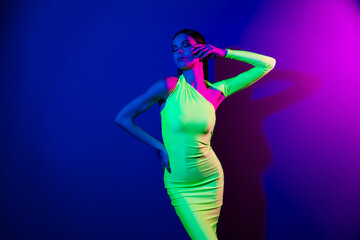 Photo of lovely slender figure model firl closed eyes hand touch face isolated on bright neon background