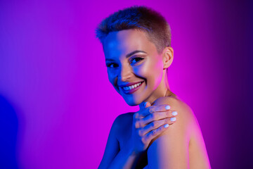 Photo of charming fancy lady celebrity touch naked shoulder isolated on violet neon color background