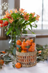 Mandarin oranges and eucalyptus centerpiece on a banquet table © Kristen