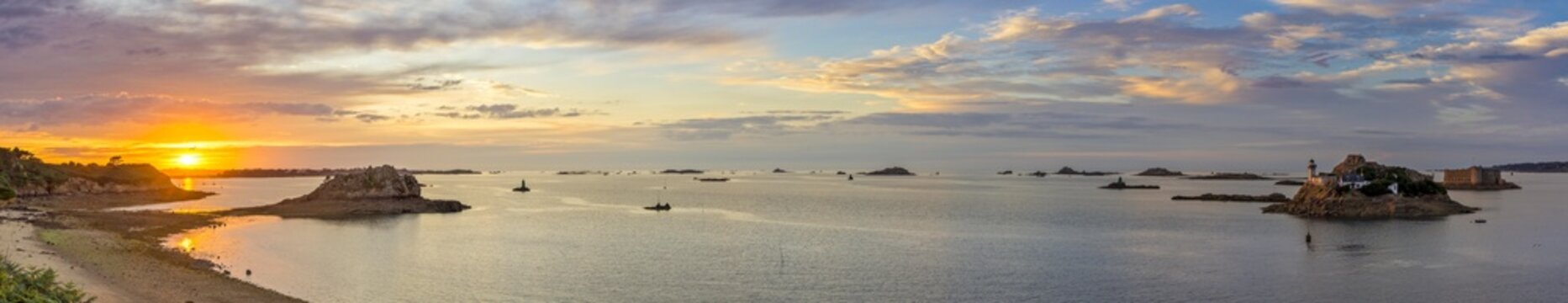 Sunset at Plage Tahiti and lighthouse on the Ile Louet and Chateau du Taureau, Carantec, Departement Finistere, France, Europe
