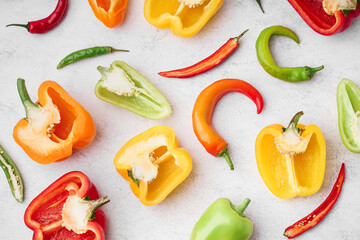 Different fresh peppers on white background