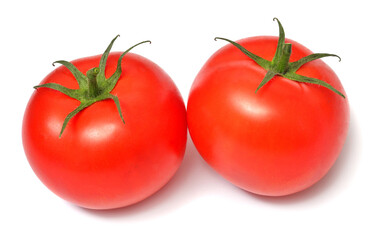 Two tomatoes isolated on white background
