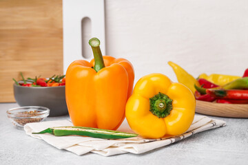 Different fresh peppers on white table