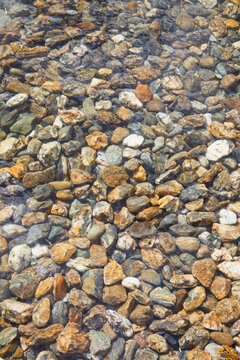 Underwater colorful river rocks.
