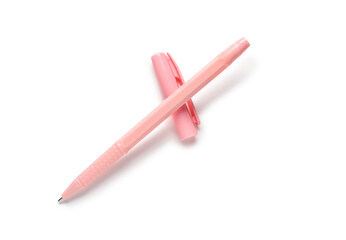 Pink ballpoint pen and cap on white background