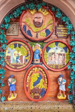 view to old historic carving on wine barrels with traditional proverbs about Love and Wine and proverb kein menschliches Wesen kann Liebe befehlen, in english - no human can order Love.