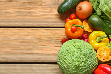 Different fresh vegetables on wooden background