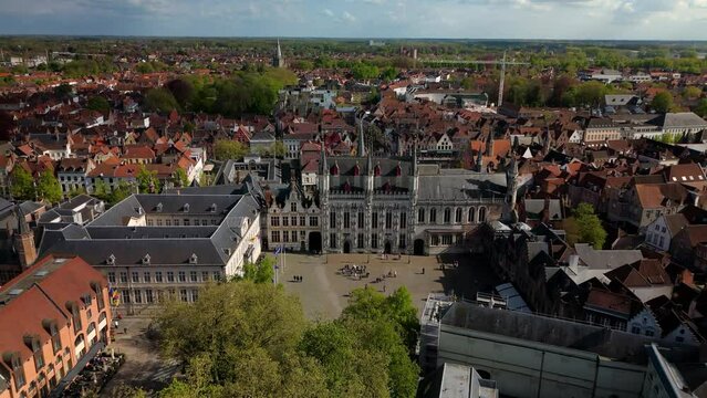De Burg Brugges Belgium drone aereal backwards sunny day
