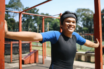 Confidence Young Asian Sportsman Preparing To Workout In Fitness Outdoors