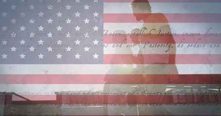 Image of flag of united states of america over happy friends on beach